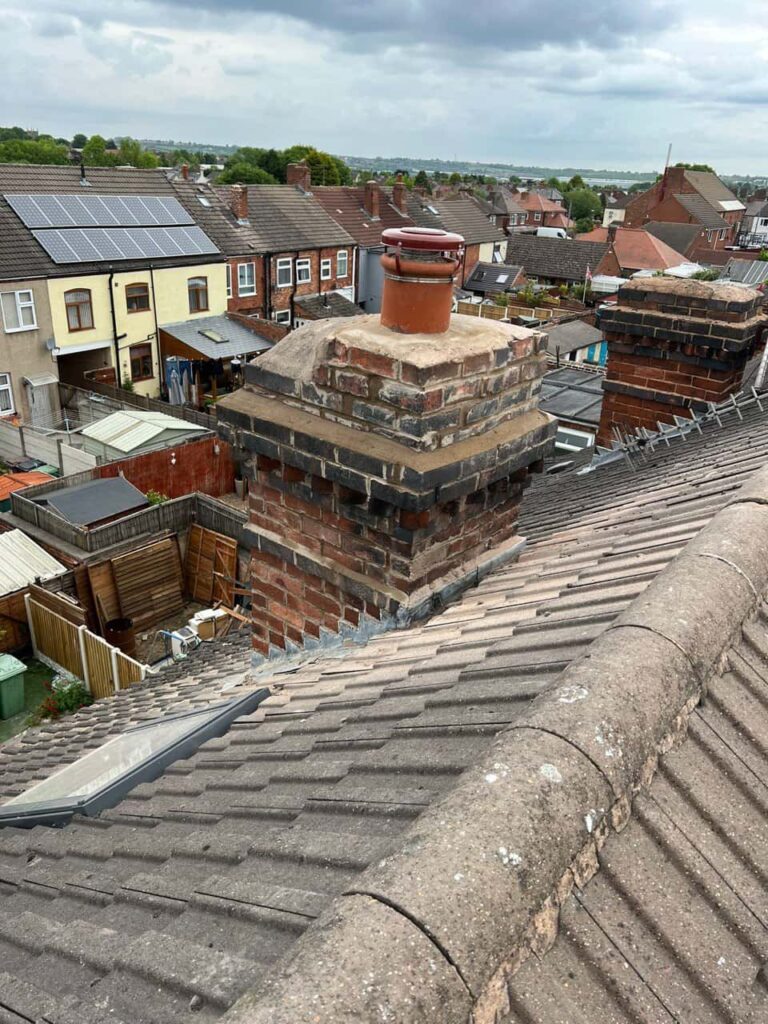 This is a photo taken from a roof which is being repaired by Rainworth Roofing Repairs, it shows a street of houses, and their roofs